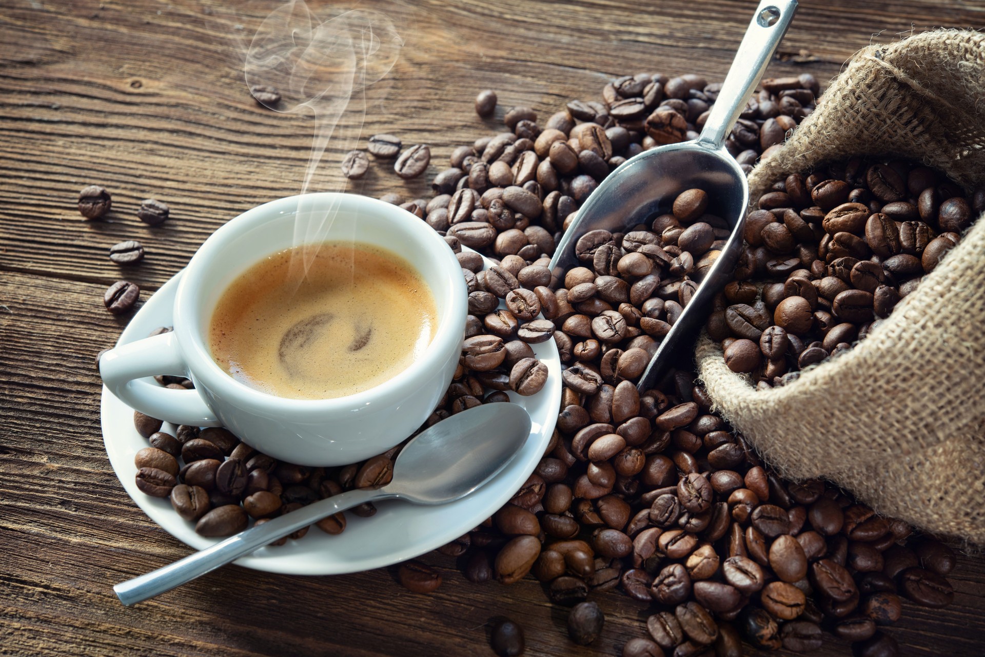 Cup of intense espresso with coffee beans